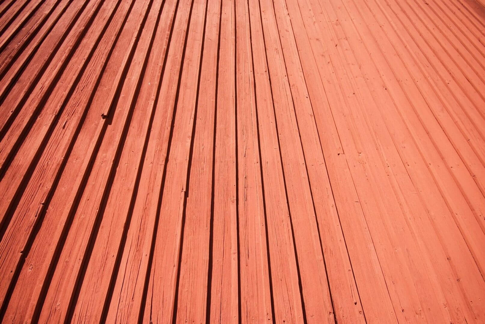 Sunlit orange corrugated roof with grooves