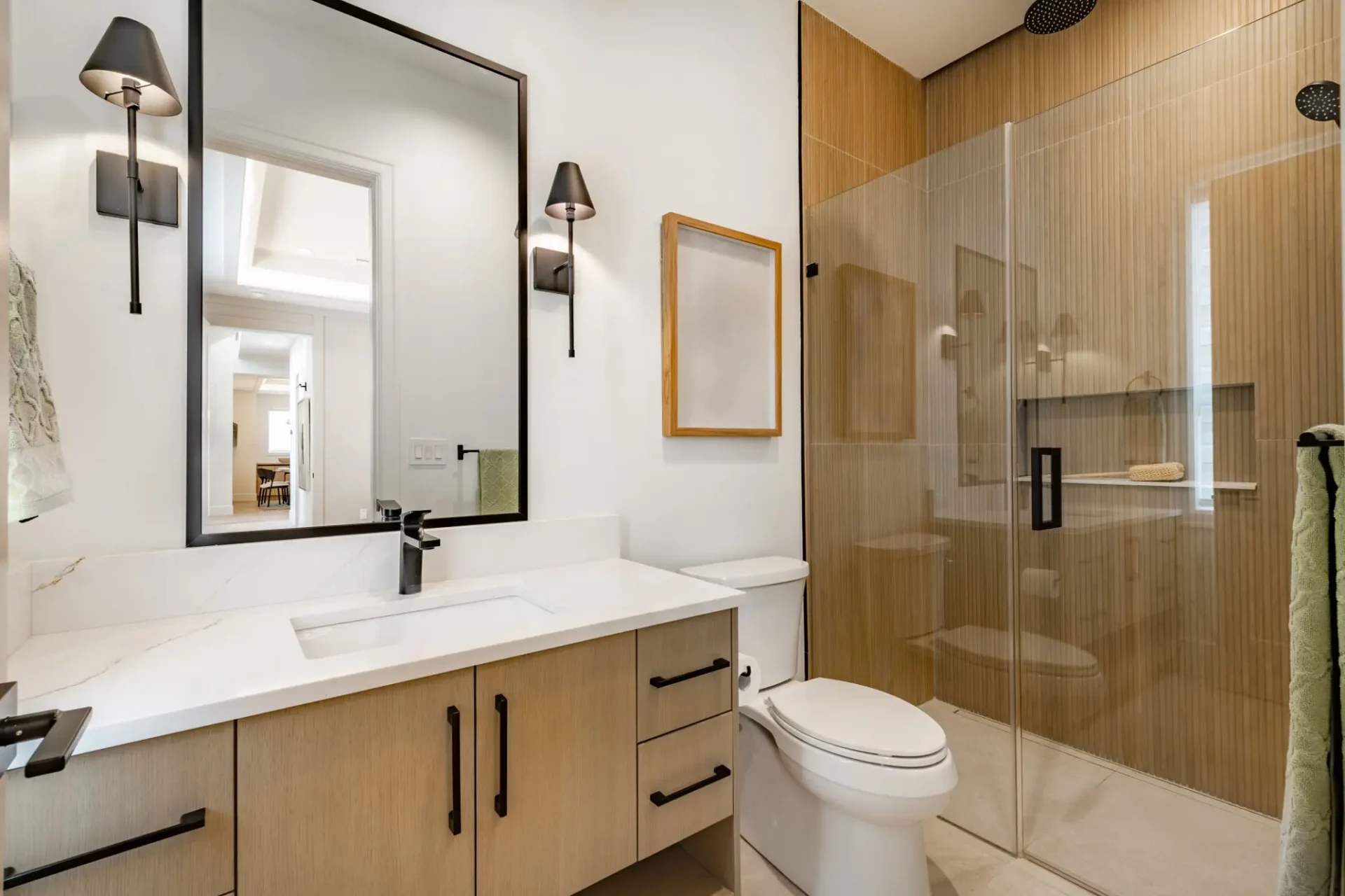 Modern wood-tone bathroom with glass shower