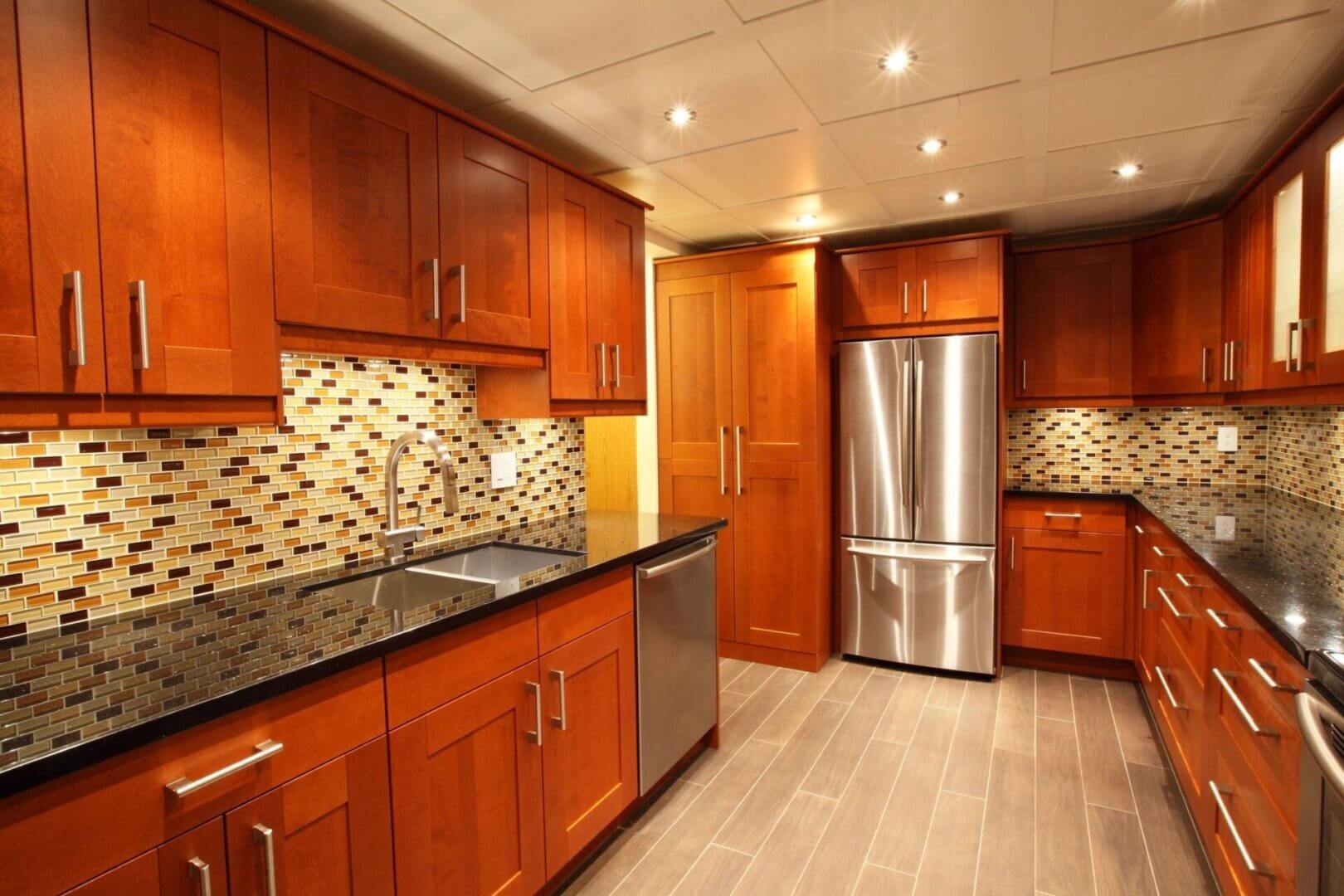 Modern kitchen with wood cabinets, tile backsplash