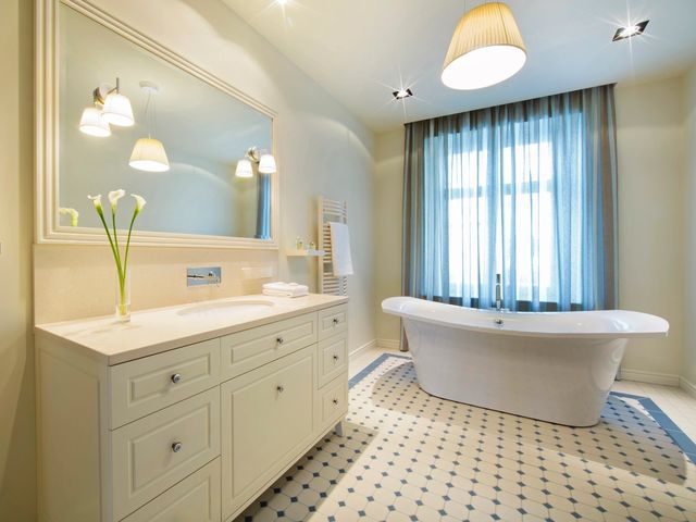 Bright bathroom with freestanding tub and vanity