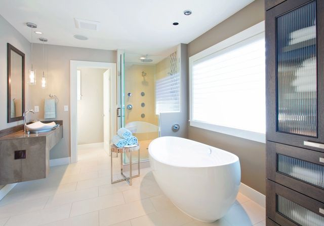 Bright contemporary bathroom with oval soaking tub